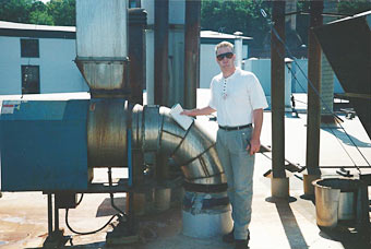 Patrick smith, VP, inspecting large exhaust system at Tool Gage Manufacturer.